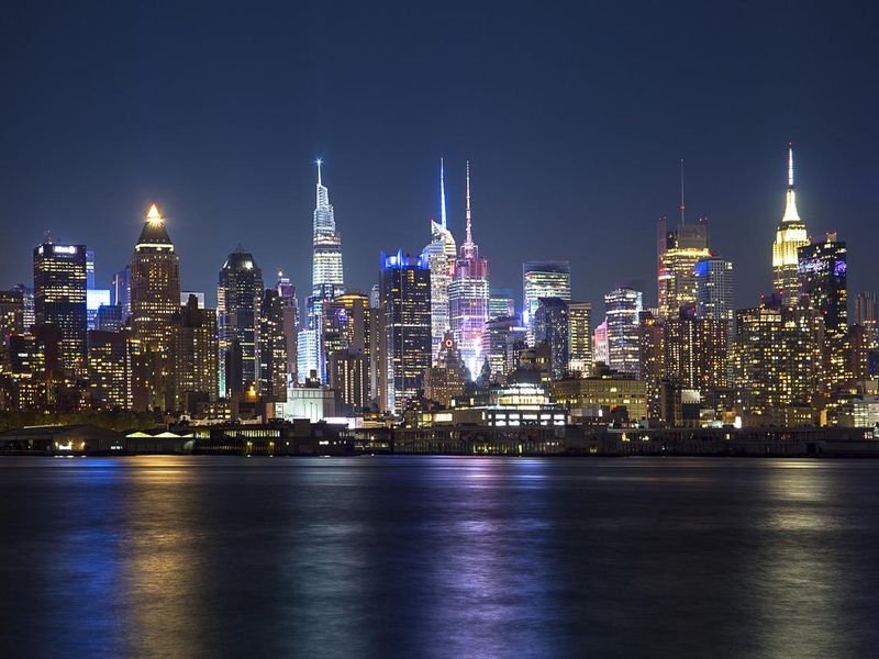 New York at night with reflective city lights