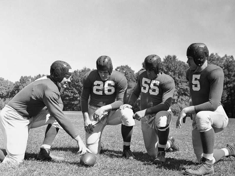 New York Giants Mel Hein interacts with teammates