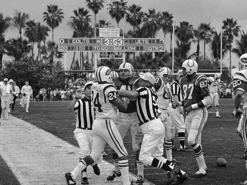 New York Jets defensive back Johnny Sample mixes it up with the Baltimore Colts in Super Bowl III