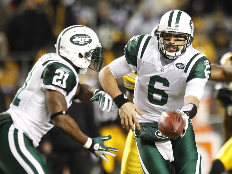 New York Jets quarterback Mark Sanchez hands ball to running back LaDainian Tomlinson