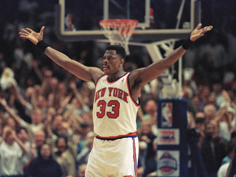 New York Knicks center Patrick Ewing pumps up fans crowded into New York's Madison Square Garden