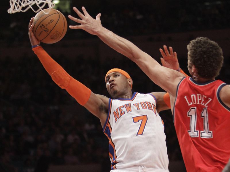 New York Knicks forward Carmelo Anthony drives against Brook Lopez