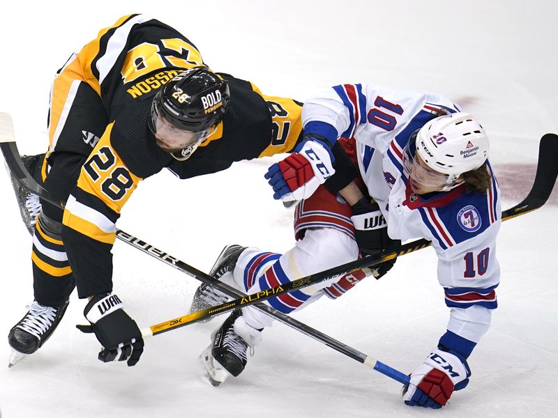New York Rangers' Artemi Panarin collides with Pittsburgh Penguins' Marcus Pettersson