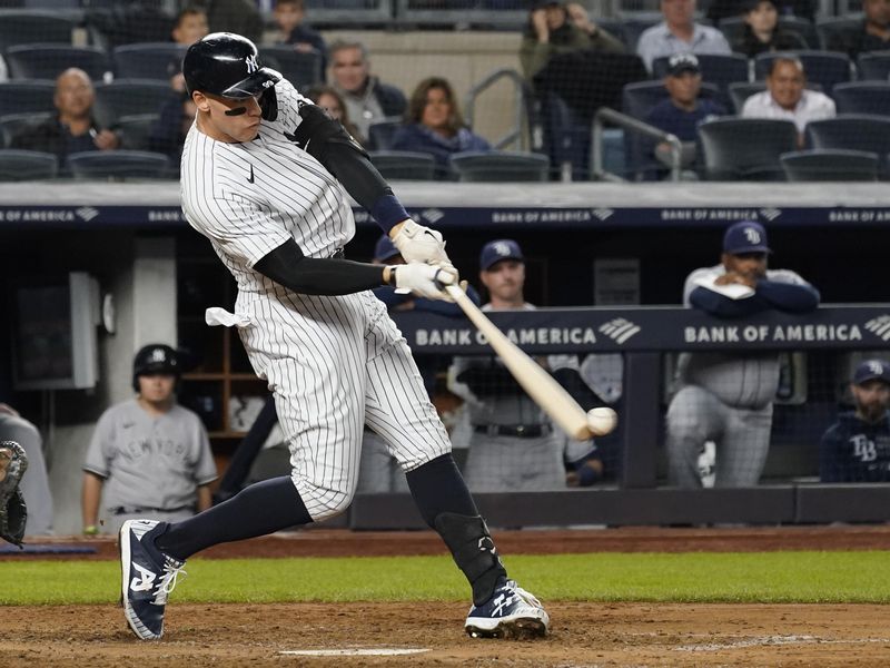 New York Yankees' Aaron Judge singles against Tampa Bay Rays