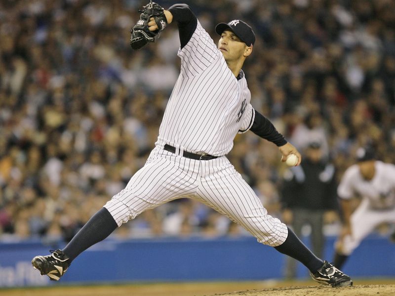 New York Yankees Andy Pettitte winds up for delivery against Boston Red Sox