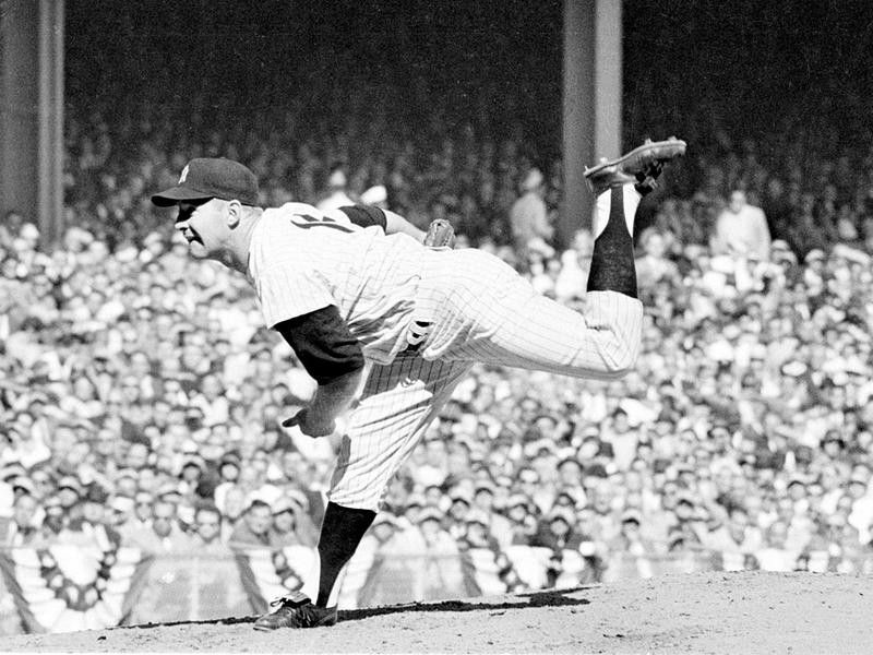 New York Yankees pitcher Whitey Ford throws against Pittsburgh Pirates