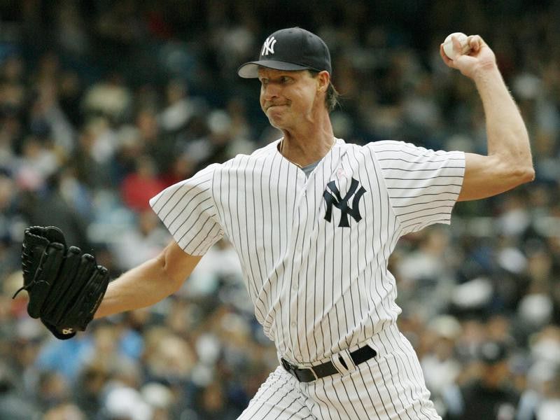 New York Yankees Randy Johnson winds up for pitch against Oakland Athletics