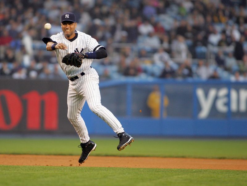 New York Yankees shortstop Derek Jeter throws the ball
