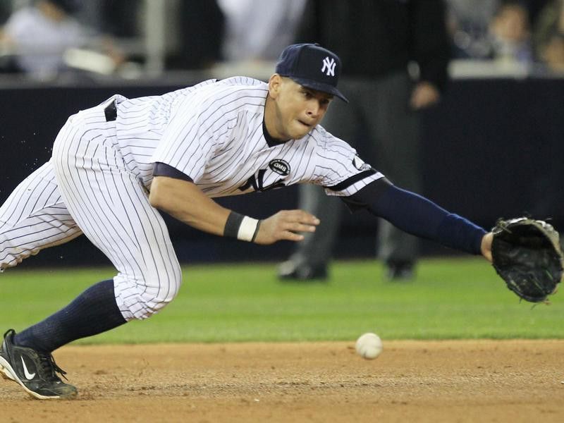 New York Yankees third baseman Alex Rodriguez dives for a grounder