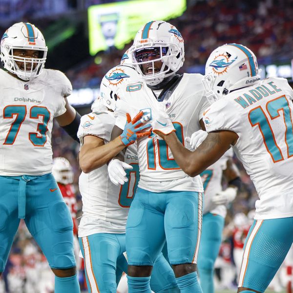 Miami Dolphins wide receiver Tyreek Hill (10) celebrates with guard Austin Jackson (73), wide receiver Braxton Berrios (0) and wide receiver Jaylen Waddle (17) after scoring a touchdown during the first half of an NFL football game against the New England Patriots on Sunday, Sept. 17, 2023, in Foxborough, Mass. (AP Photo/Greg M. Cooper)