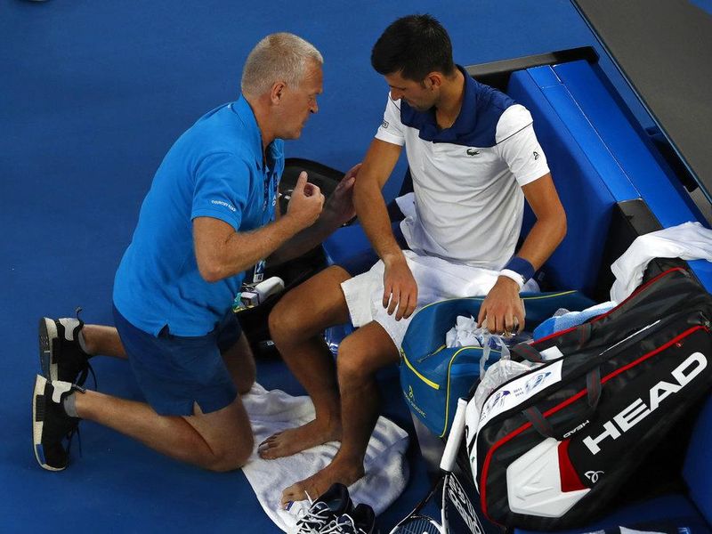 Novak Djokovic gets medical treatment on the court