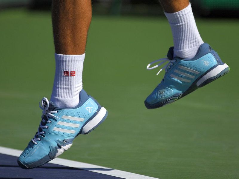 Novak Djokovic wearing Adidas shoes