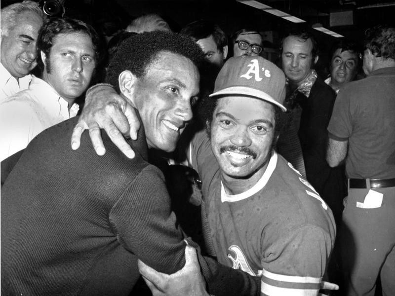Oakland Athletics's center fielder Reggie Jackson gets congratulatory hug