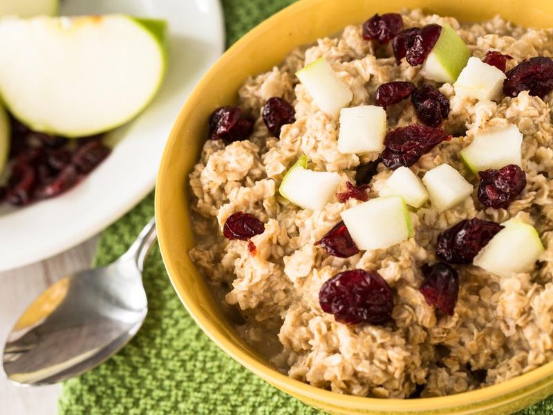 Oatmeal In A Bowl With Apples And Cranberries