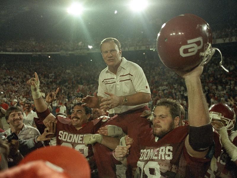 Oklahoma coach Barry Switzer carried off the field by players