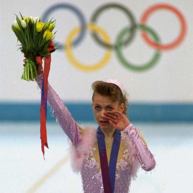 Oksana Baiul wipes away a tear after accepting gold medal