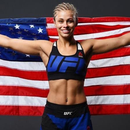 Paige VanZant posing with American flag