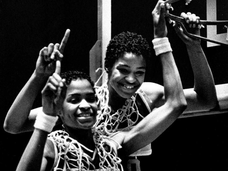 Pam McGee and her twin Paula of University of Southern Carolina pose after winning the NCAA women's basketball championship