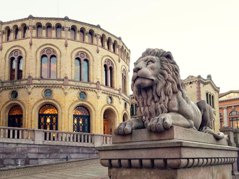 Parliament of Norway building with lion sculpture, Oslo