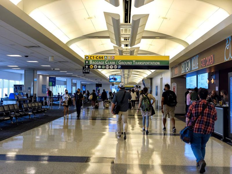 Passengers walking in Houston George Bush Intercontinental Airport