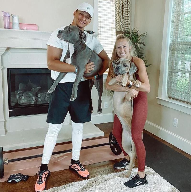 Patrick and Brittany Mahomes with their dogs