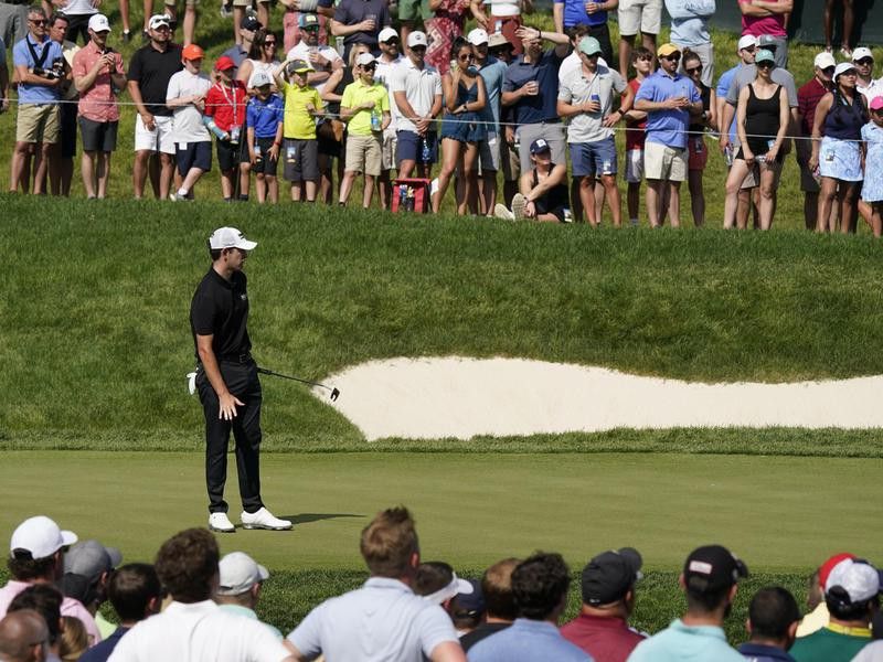 Patrick Cantlay watches hits putt at 2021 Memorial Tournament
