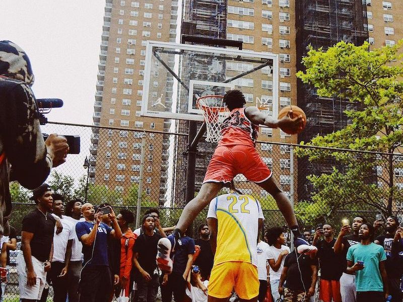 People playing basketball at Rucker Park