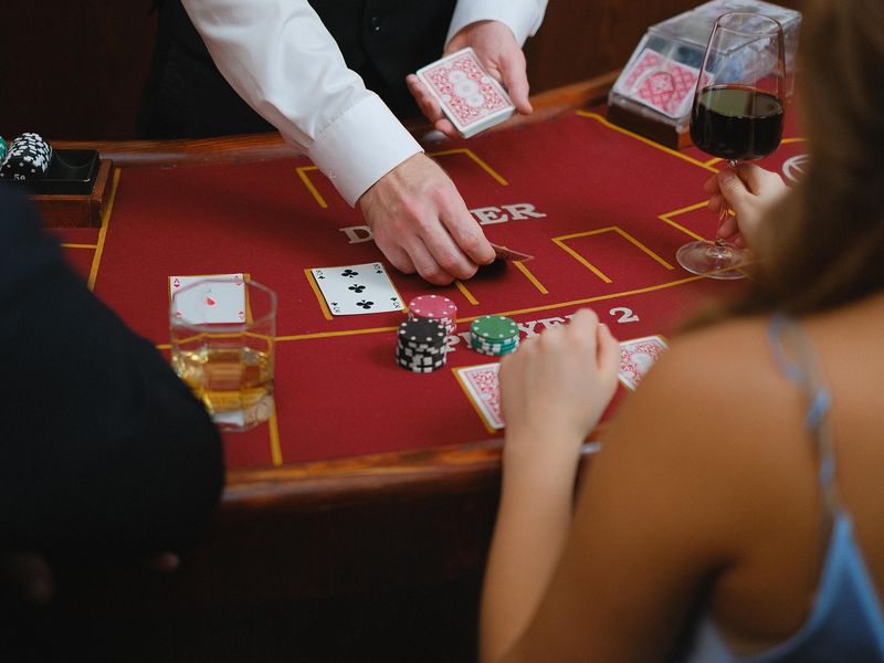 People playing poker at a table in a casino