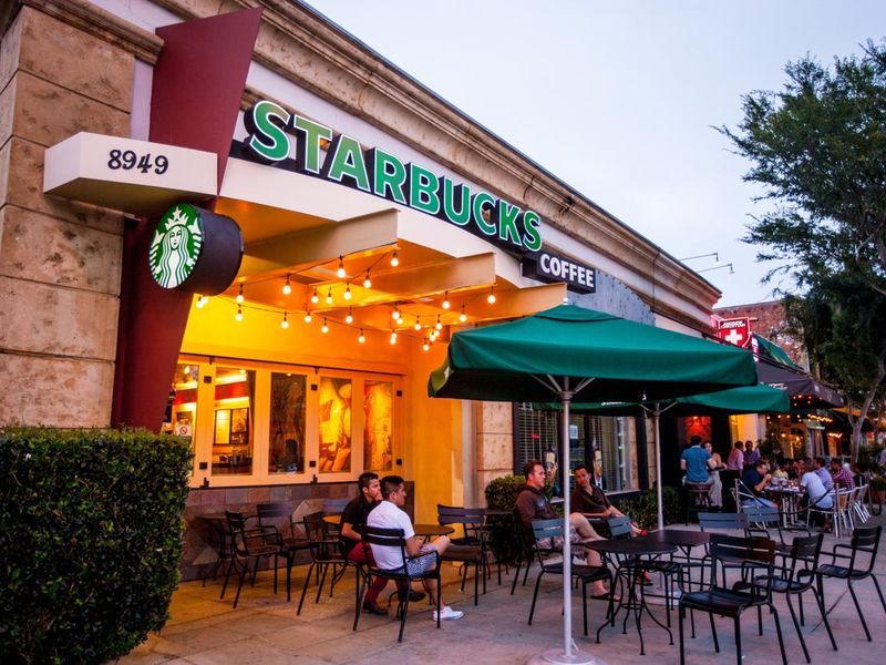People sitting at Starbucks Coffee in West Hollywood, USA