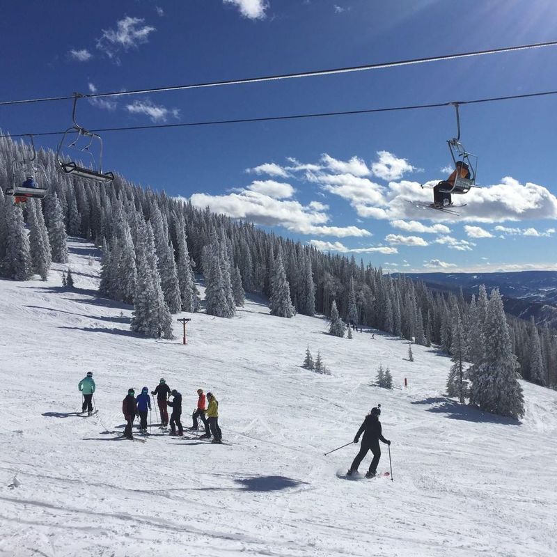 People skiing on snowy mountain
