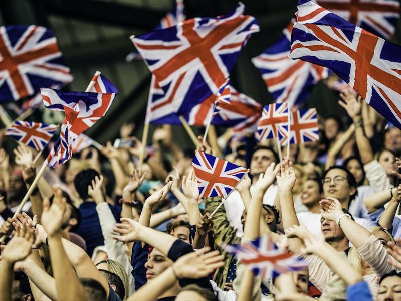 People waving British flag