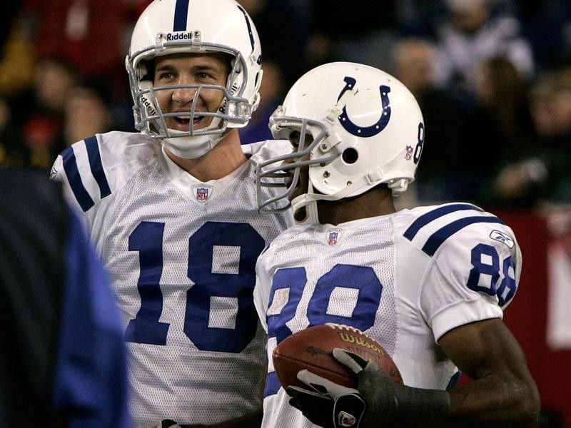 Peyton Manning smiles with Marvin Harrison