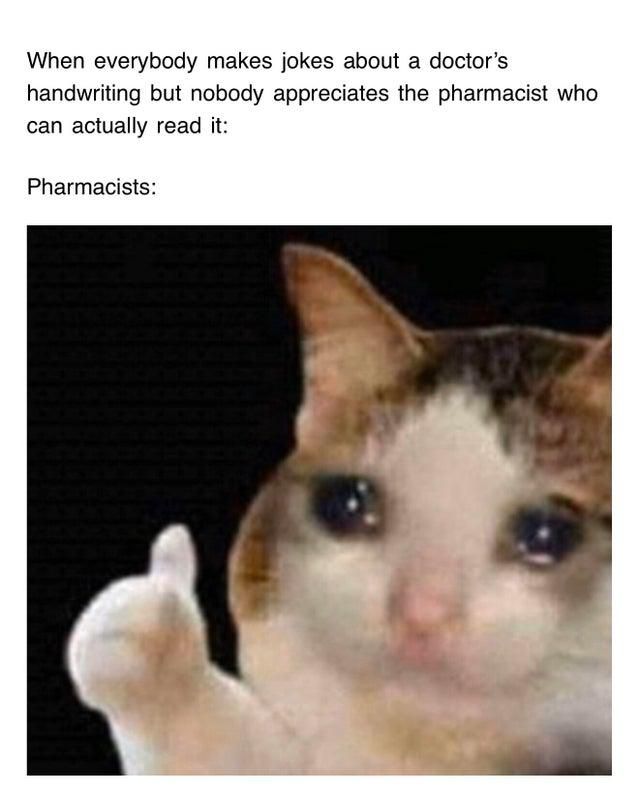 Pharmacist cat giving a thumbs up