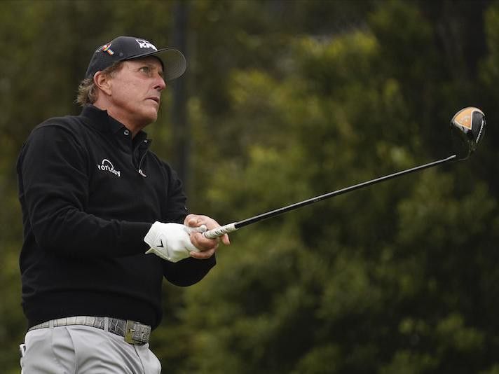 Phil Mickelson watches his tee shot