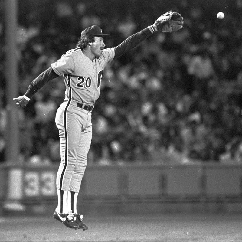 Philadelphia Phillies third baseman Mike Schmidt jumps in air to knock down fly ball