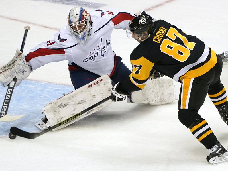 Pittsburgh Penguins' Sidney Crosby gets shot past Washington Capitals goaltender Vitek Vanecek