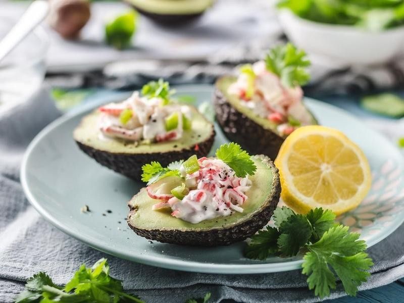 Plate of avocados with crab and lemon