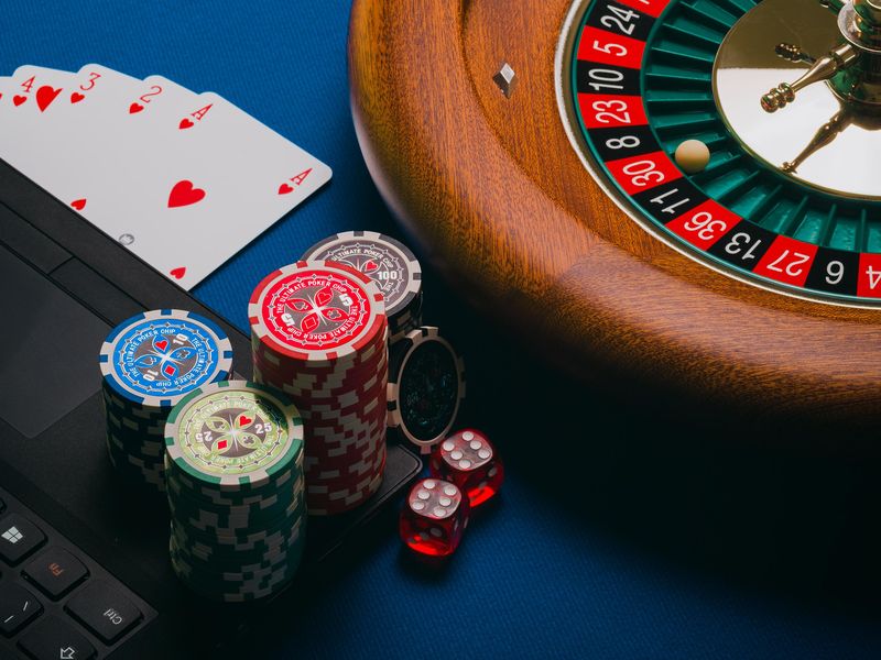 Playing cards, chips, dice and roulette wheel