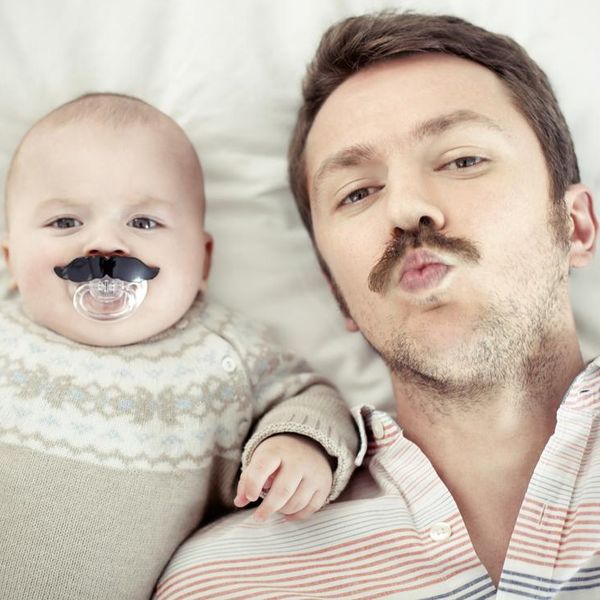 Portrait of a father with his son, both with mustaches