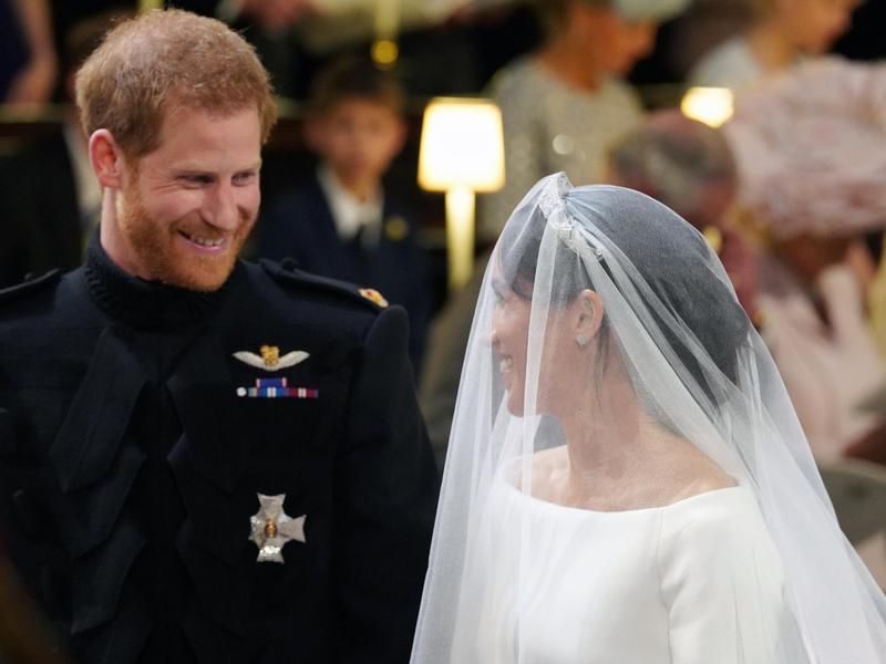 Prince Harry looks at his bride, Meghan Markle