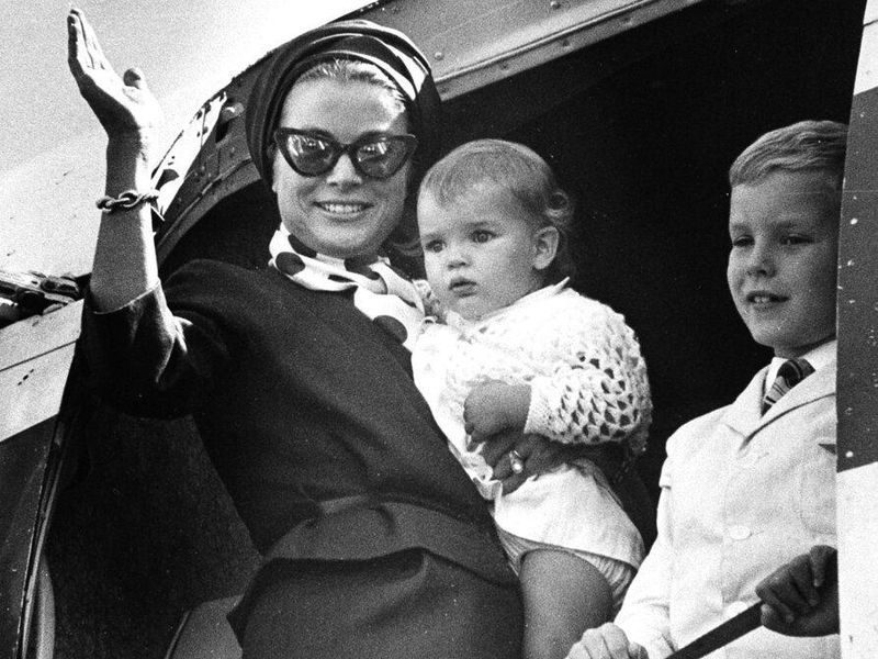 Princess Grace of Monaco, the former Grace Kelly of Philadelphia, Pa., waves from the doorway of the plane as she arrives in Boston, Ma., with her daughter, Stephanie, and son, Albert, on Sept. 8, 1966.