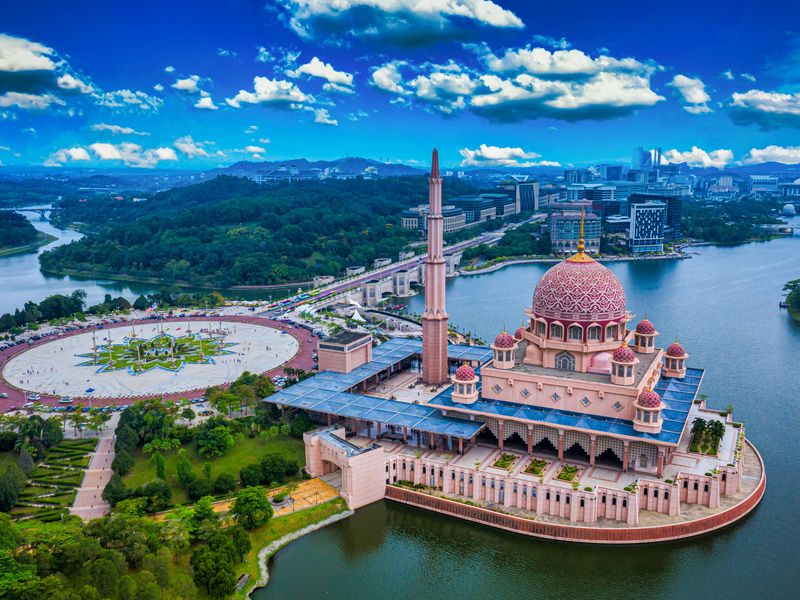 Putra Mosque with Putrajaya City Center in Putrajaya, Malaysia.