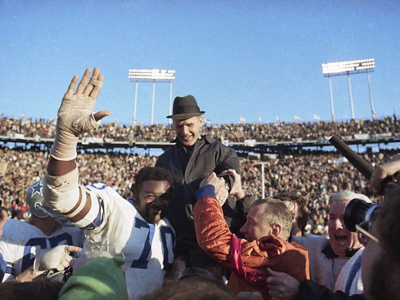 Rayfield Wright carries Tom Landry
