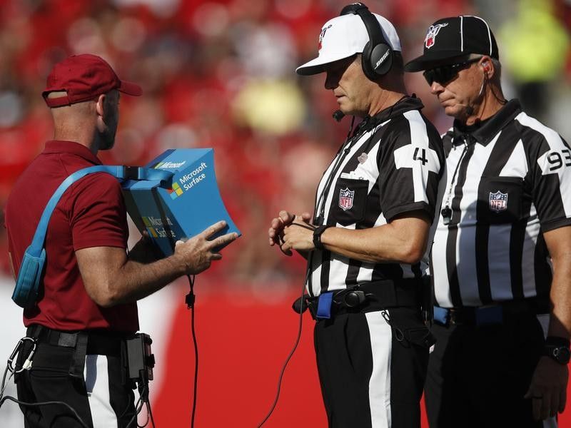 Referee reviews instant replay