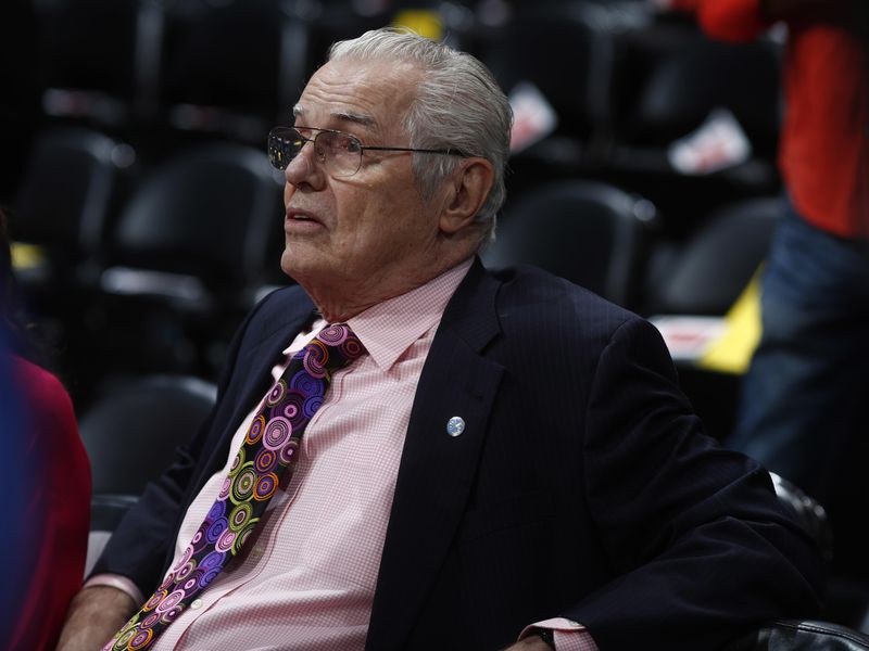 Retired Denver Nuggets head coach Doug Moe waits