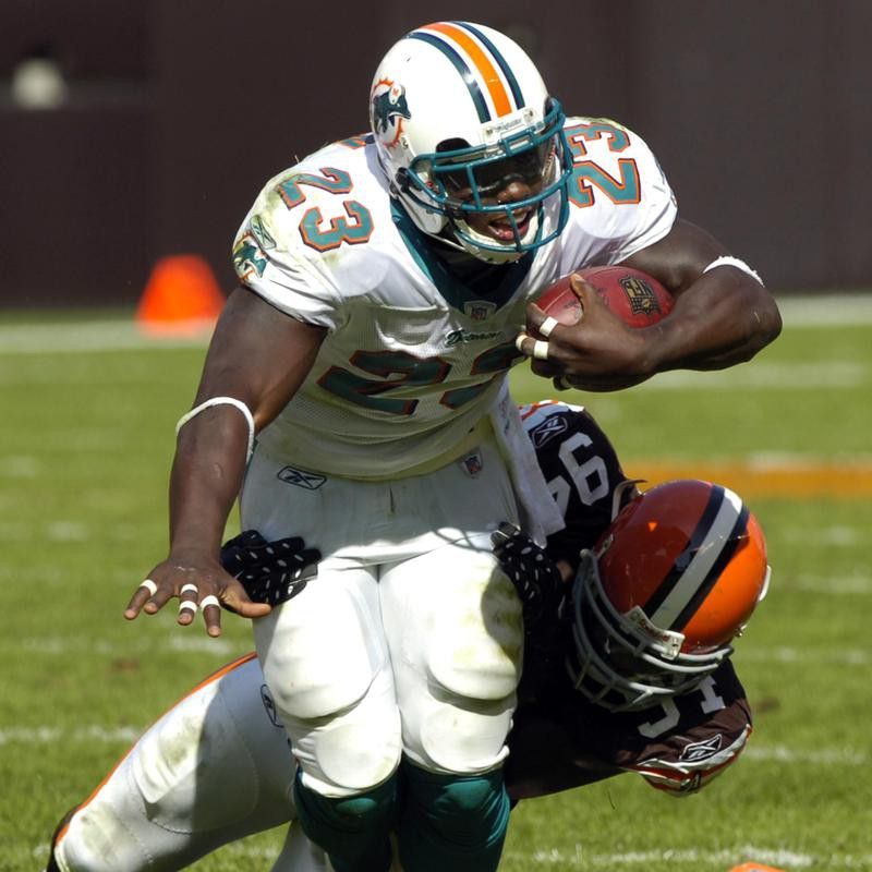 Ronnie Brown is tackled by Cleveland Browns' Leon Williams