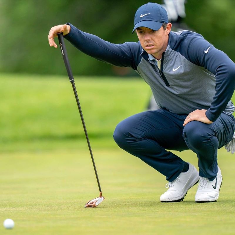 Rory McIlroy analyzes ball on course