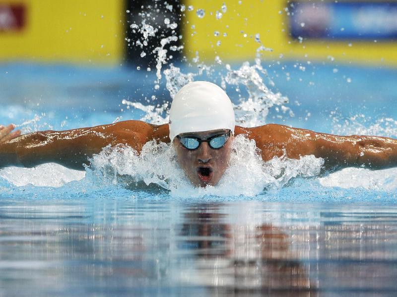 Ryan Lochte swims in men's 100-meter butterfly preliminaries