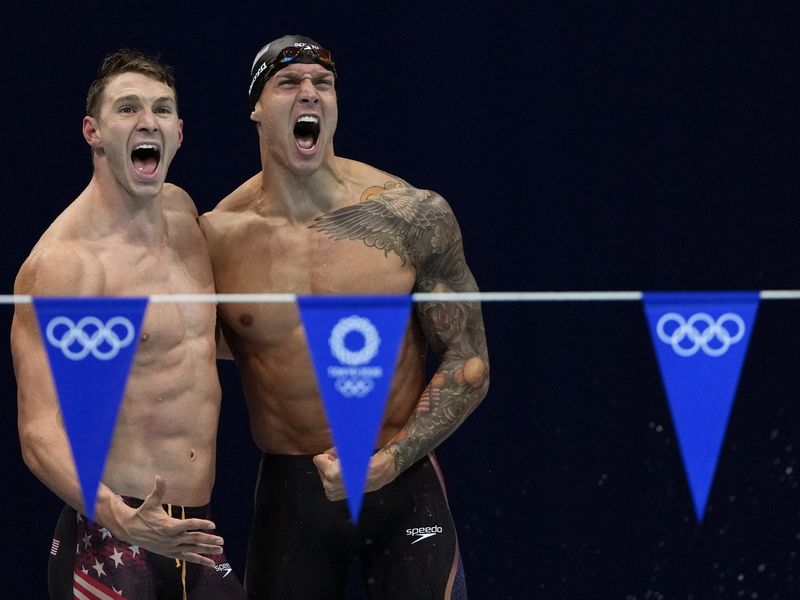 Ryan Murphy and Caeleb Dressel react after winning the gold medal in the men's 4x100-meter medley