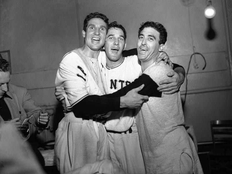 Sal Maglie with teammates celebrate their win over Brooklyn Dodgers